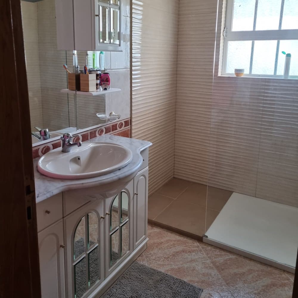 The master bathroom includes a large walk-in shower.